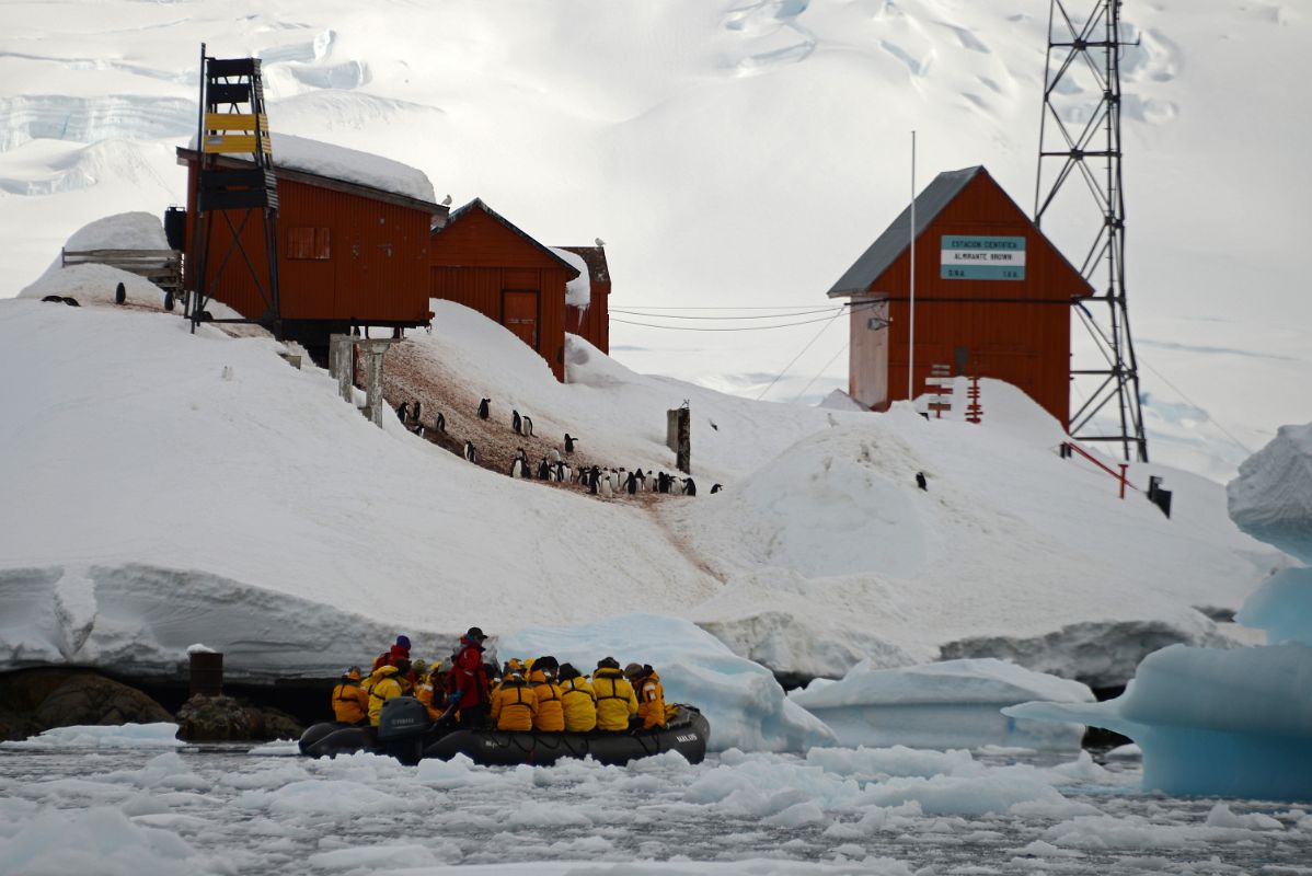 05B Zodiac Cruising Next To The Buildings Of Almirante Brown Station On Quark Expeditions Antarctica Cruise